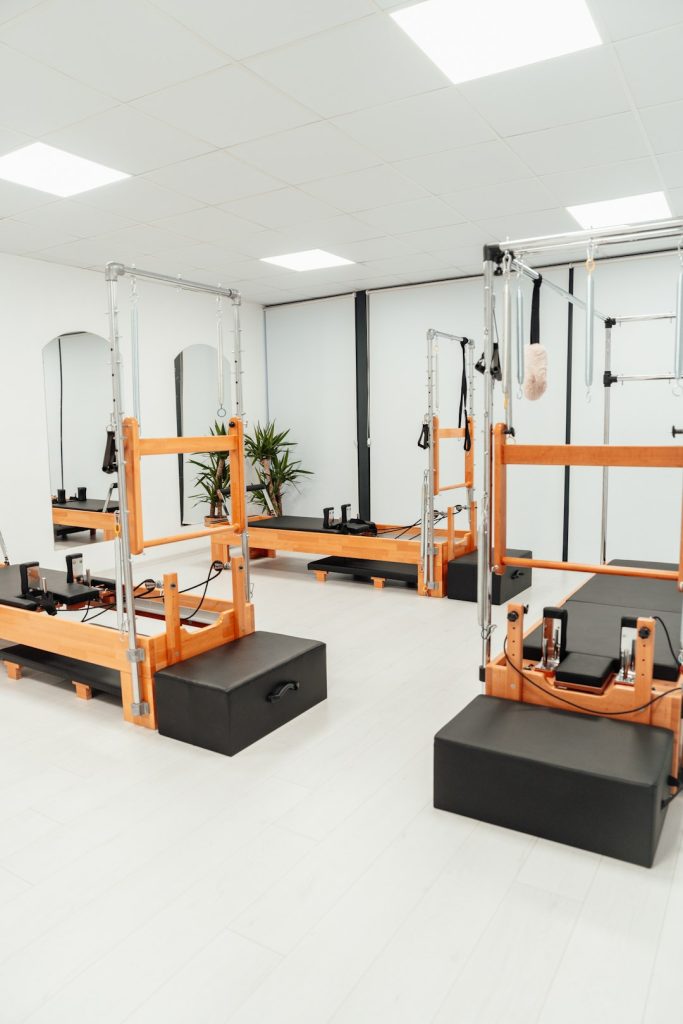 a-white-room-with-mirrors-and-equipment-in-it-ny3a6u9hvt0